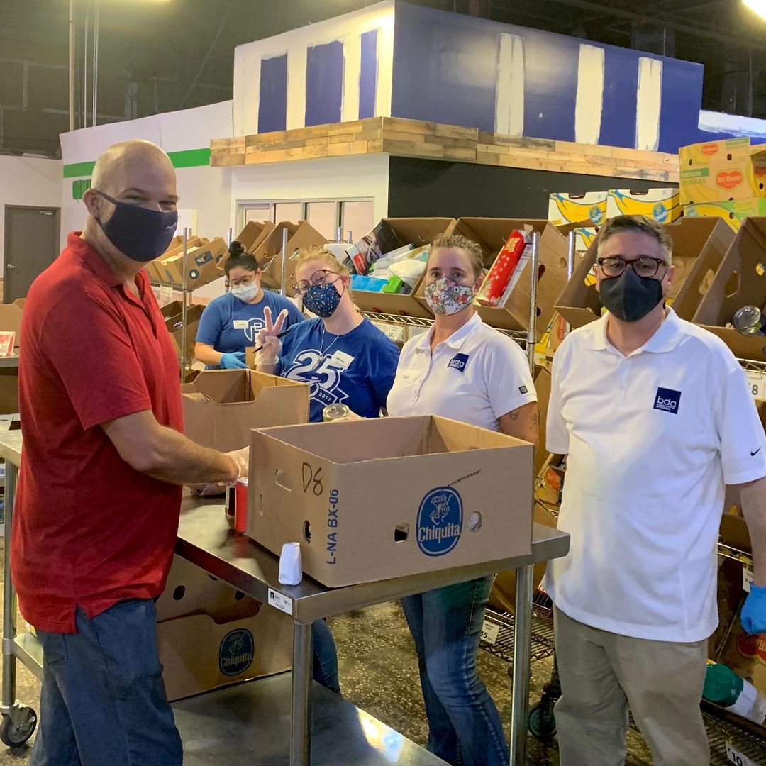 Volunteers preparing food boxes in a Lakeland community pantry